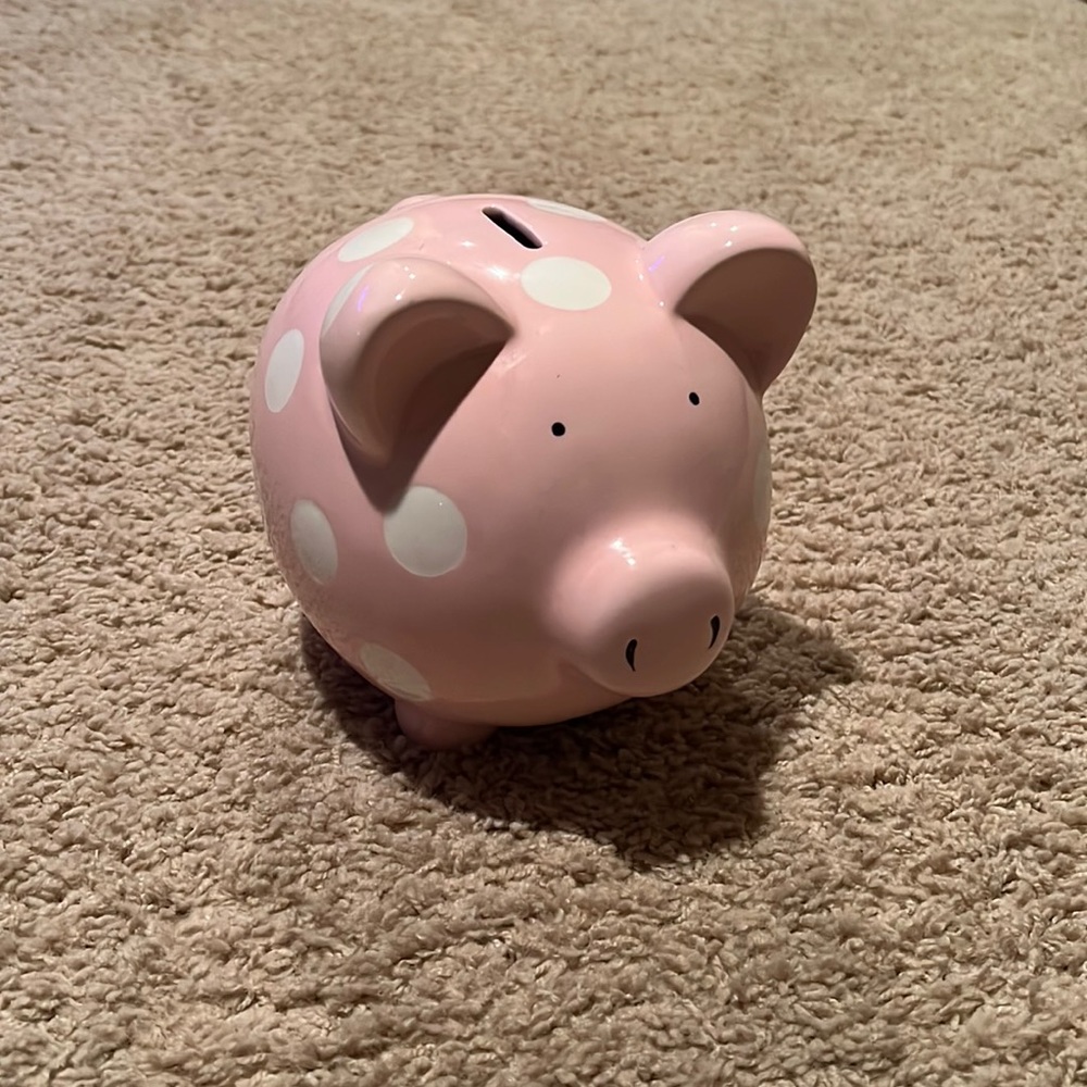 Glass light pink polka dot piggy bank. Looks new. Size of head